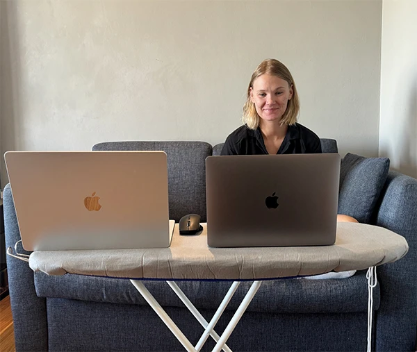 A funny workplace with two laptops on a ironing board